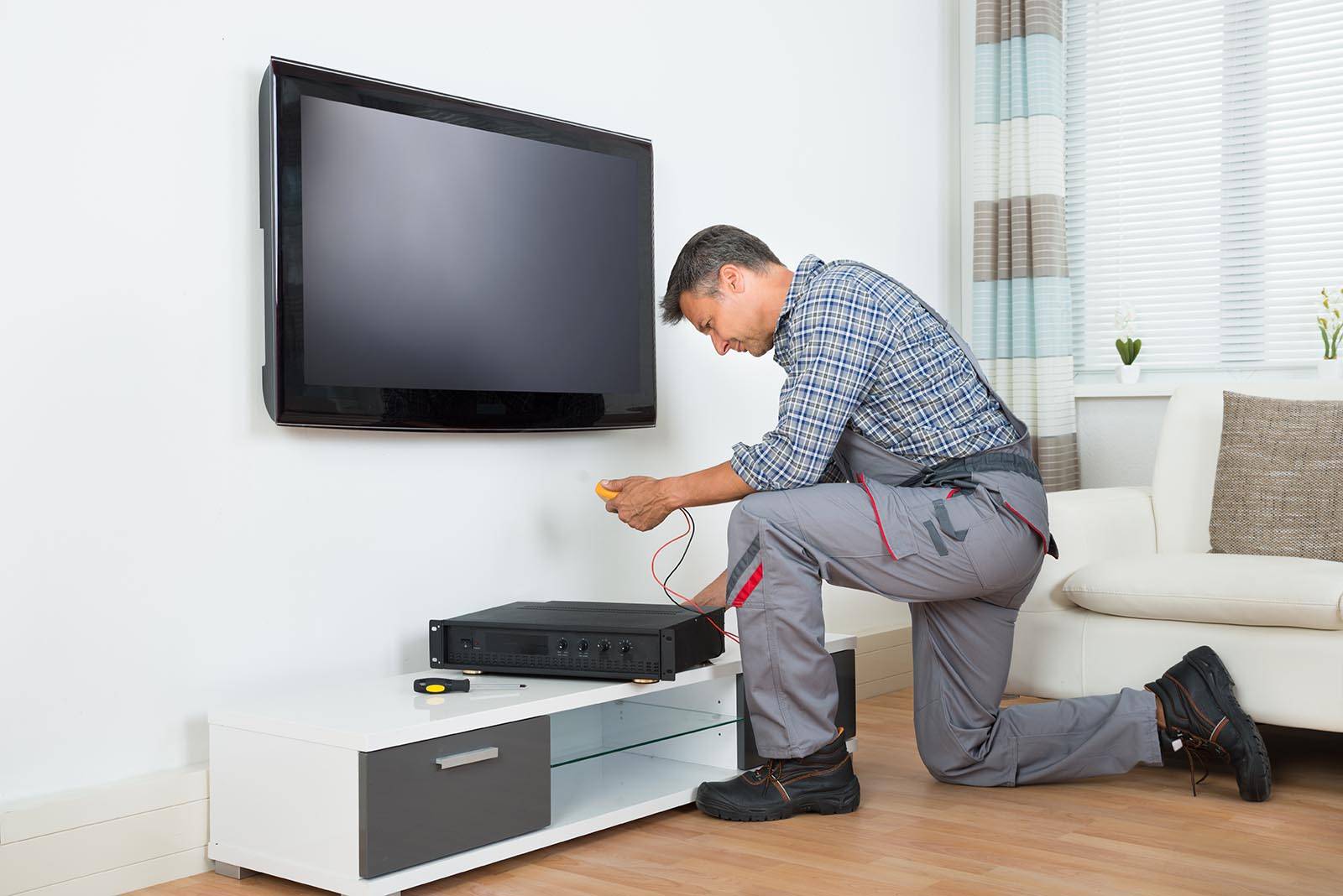 Technician installing freeview box