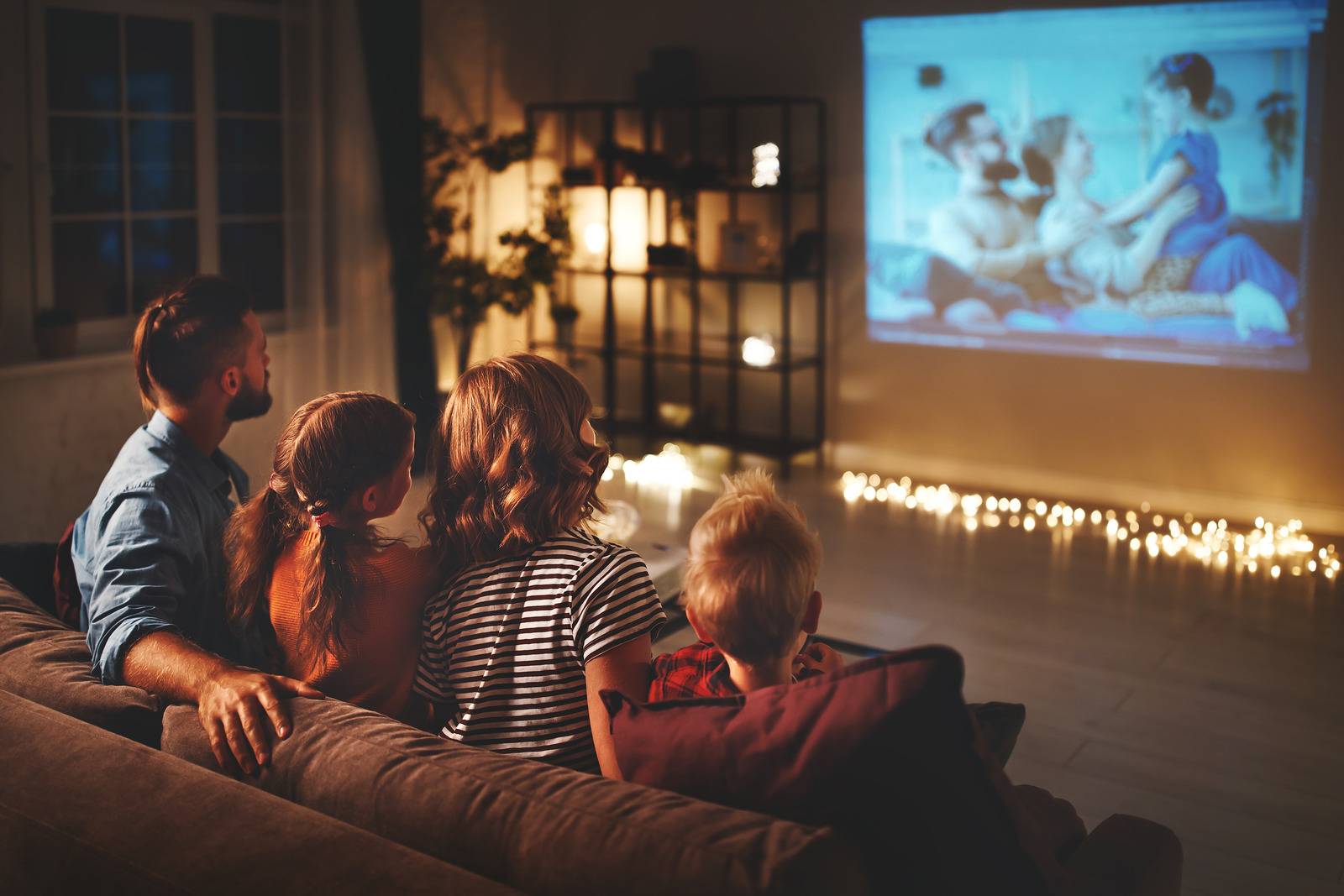 family watching projector tv